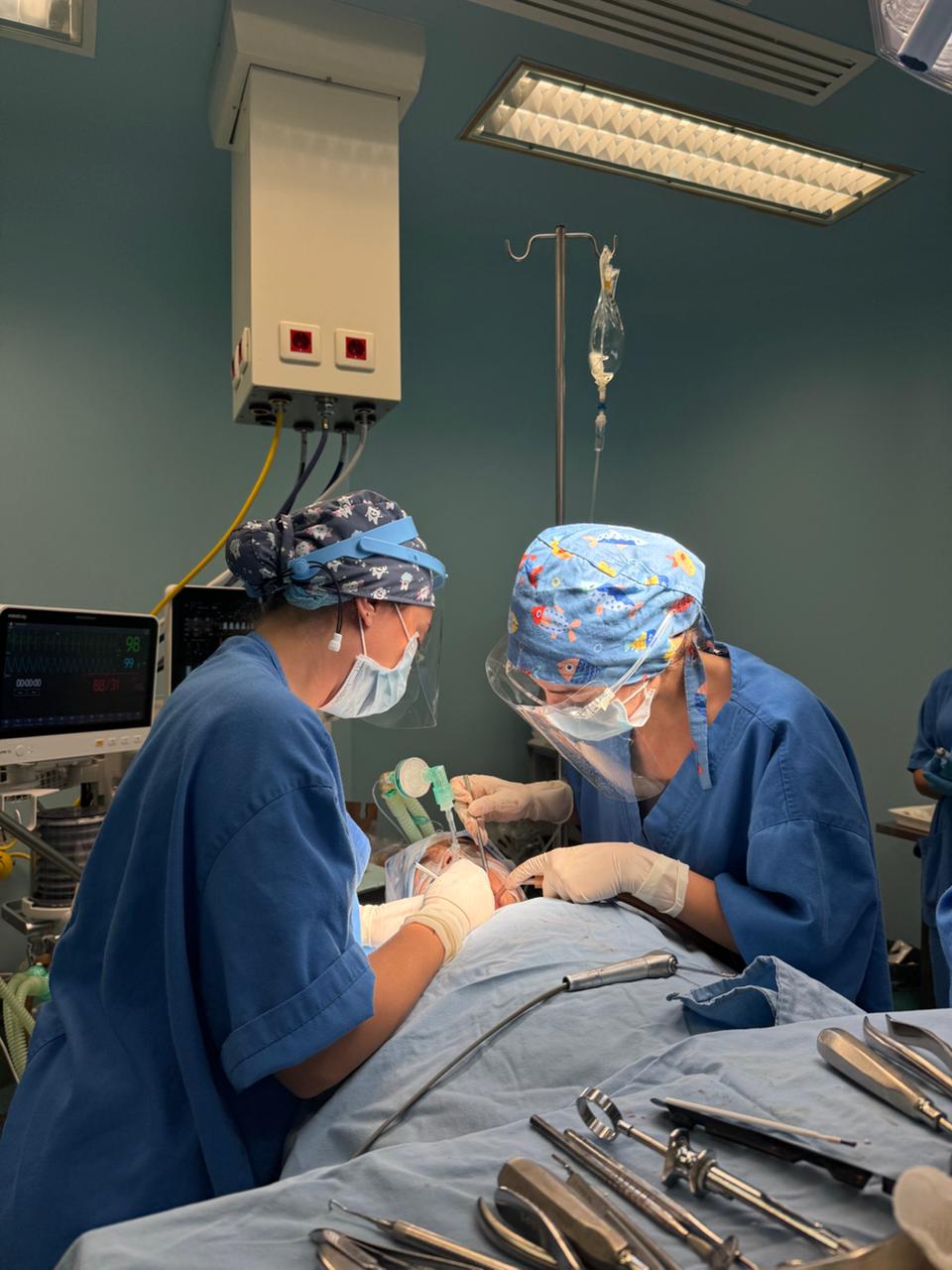 Dr. Marilyn Nohra treating a child under general anesthesia in a Beirut hospital operating room